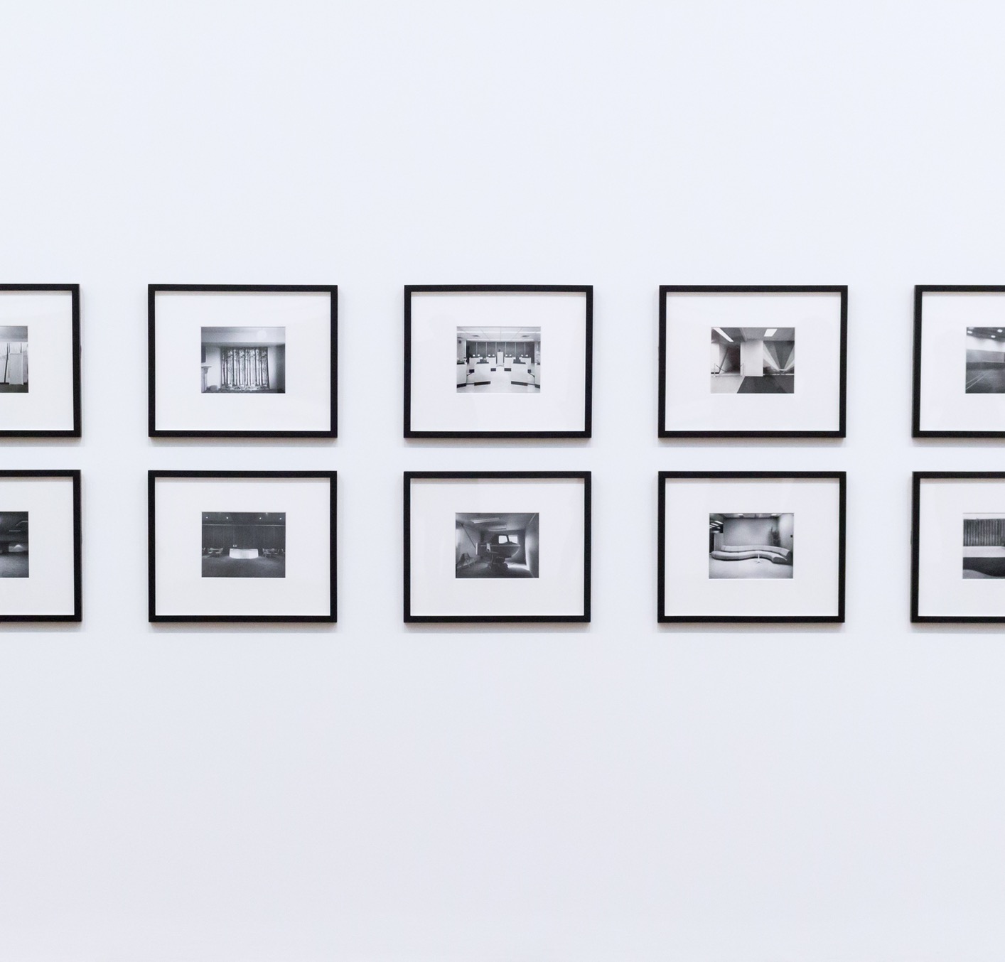 wall of framed pictures